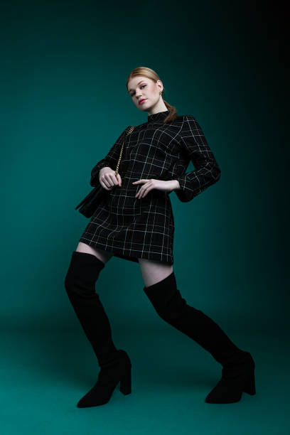 beautiful and elegant woman on plain background - fashion stock pictures, royalty-free photos & images