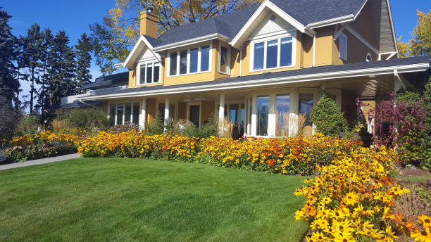 beautiful bright and cheery tradional home on a lovely autumn afternoon - garden decoration stock pictures, royalty-free photos & images