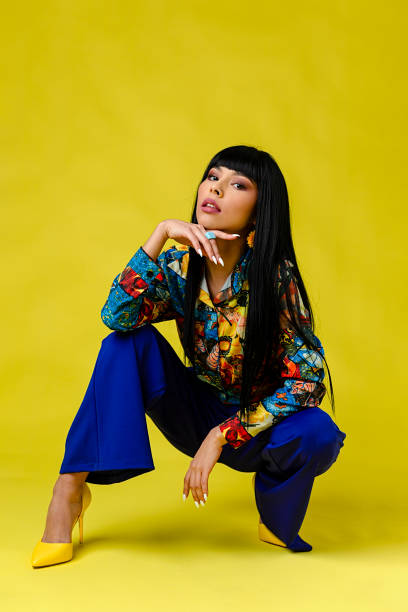 beautiful woman in front of plain background - fashion stock pictures, royalty-free photos & images