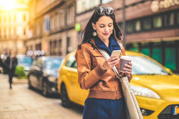 beautiful woman spending time in the city - junk food stock pictures, royalty-free photos & images