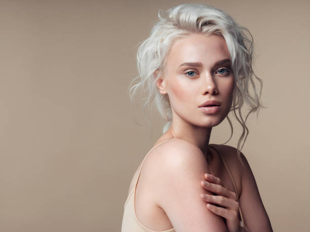 beautiful woman with make-up and stylish hairstyle - hairstyle stock pictures, royalty-free photos & images