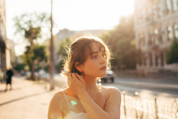 beautiful young woman walking on the city street during summer - fashion stock pictures, royalty-free photos & images