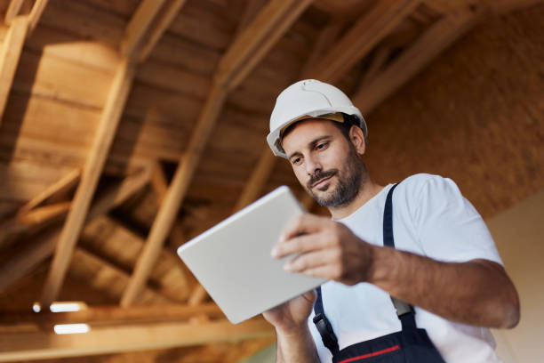 below view of manual worker using touchpad at construction site. - home decoration stock pictures, royalty-free photos & images