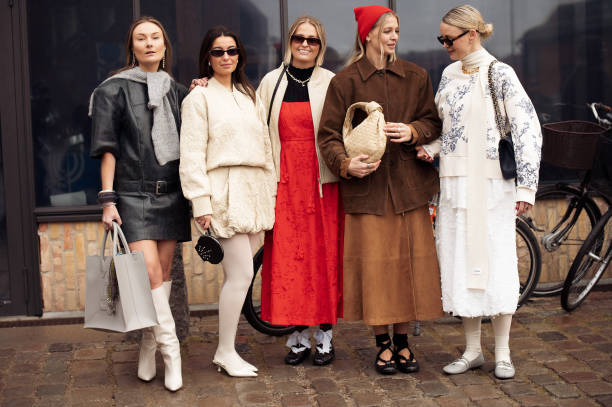 Benthe Liem, Hollie Mercedes Peters and Sonja Leigh poses outside the Munthe fashion show during the Copenhagen Fashion Week Autumn/Winter 2025 on...