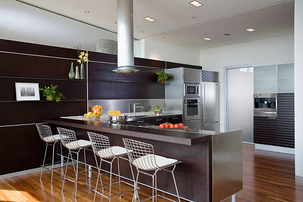 bertoia stools at counter in contemporary kitchen - home decoration stock pictures, royalty-free photos & images