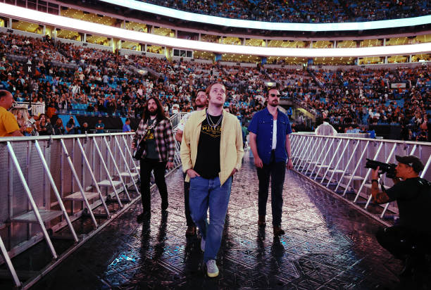 Billy Strings walks to the stage at the Concert For Carolina Benefit Concert at Bank of America Stadium on October 26, 2024 in Charlotte, North...