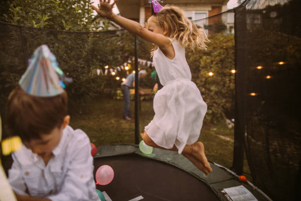 birthday party on a trampoline - garden decoration stock pictures, royalty-free photos & images