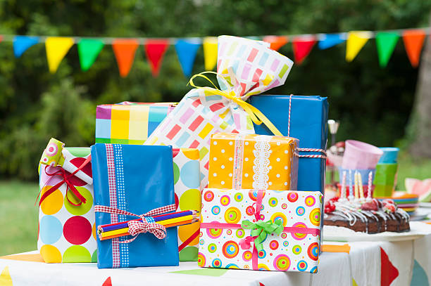 birthday present on garden table - garden decoration stock pictures, royalty-free photos & images