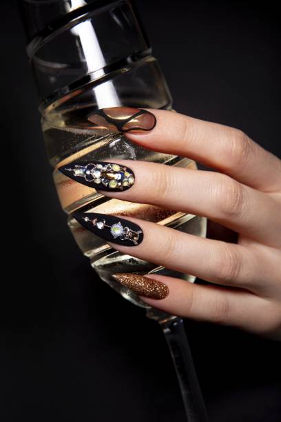 black and gold manicure with diamonds. high-quality photo - nails art stock pictures, royalty-free photos & images