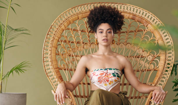 black woman on throne chair, queen empowerment in portrait and trendy african designer fashion in jamaica. sitting on olive background in studio, beauty in creative culture and young confident girl - fashion stock pictures, r