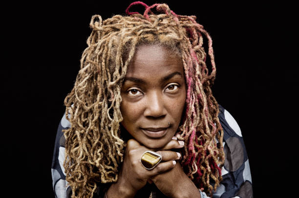 blond dreadlocks studio portrait on black - hairstyle stock pictures, royalty-free photos & images