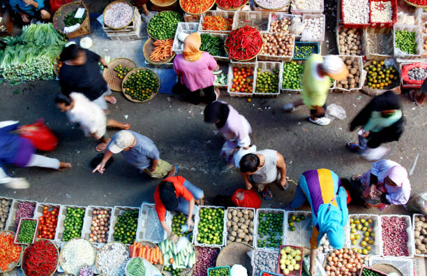 blurred motion of people at vegetable market - food stock pictures, royalty-free photos & images