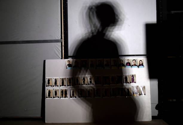 Board with photographs of models are seen backstage before the araisara Sara Arai Collection show during China Fashion Week in Beijing on March 27,...