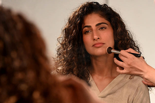 Bollywood actress Kubra Sait gets dressed backstage at the Lakme Fashion Week x FDCI, in Mumbai on March 28, 2025.