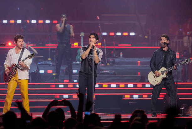 Boston, MA From left, Nick, Kevin and Joe Jonas perform in concert as The Jonas Brothers at TD Garden.