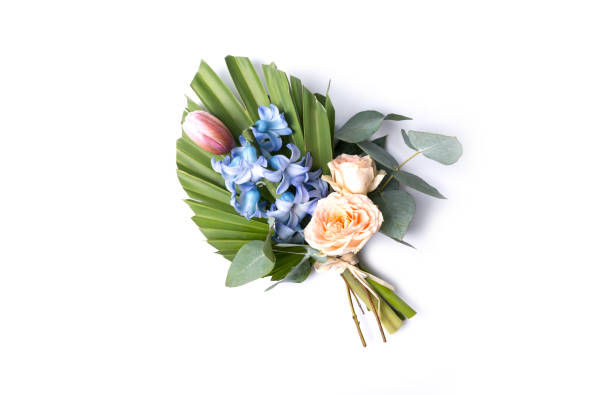 bouquet of tropical leaves with roses, tulip and hyacinth, branch palm with colorful flowers on a white background. - garden decoration stock pictures, royalty-free photos & images