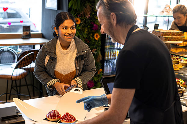 boxing up strawberry tarts - junk food stock pictures, royalty-free photos & images