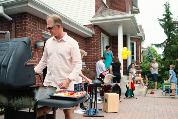 boy's band getting ready to play in family driveway. - concert stock pictures, royalty-free photos & images