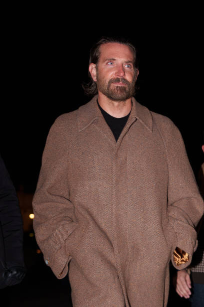 Bradley Cooper wears a brown long winter coat, before the Louis Vuitton Menswear Fall-Winter 2025/2026 show as part of Paris Fashion Week on January...
