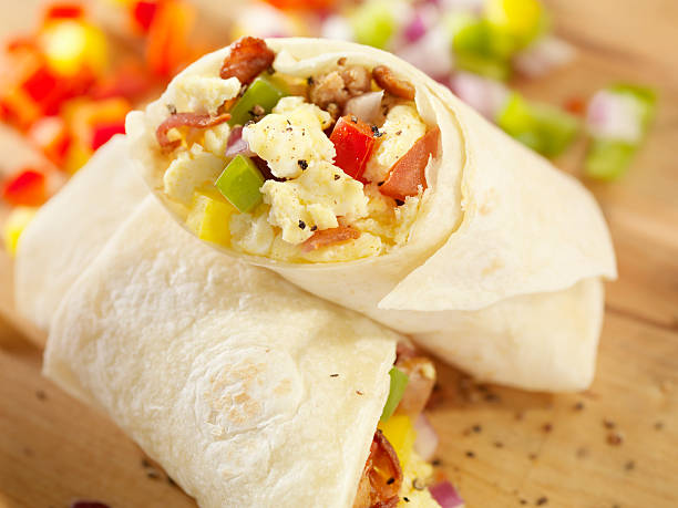 breakfast burrito with scrambled eggs - junk food stock pictures, royalty-free photos & images