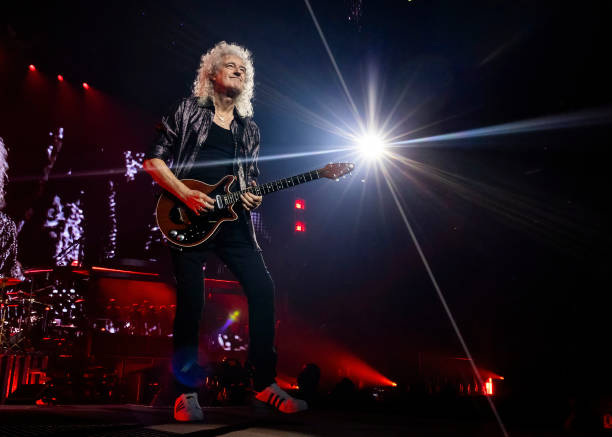 Brian May of Queen + Adam Lambert performs at Little Caesars Arena on October 10, 2023 in Detroit, Michigan.