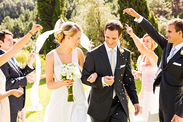 bride and groom procession after wedding - garden decoration stock pictures, royalty-free photos & images