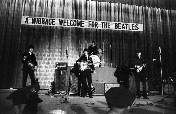 British pop group the Beatles perform onstage at Convention Hall during their first US tour, Philadelphia, Pennsylvania, September 2, 1964. Pictured...