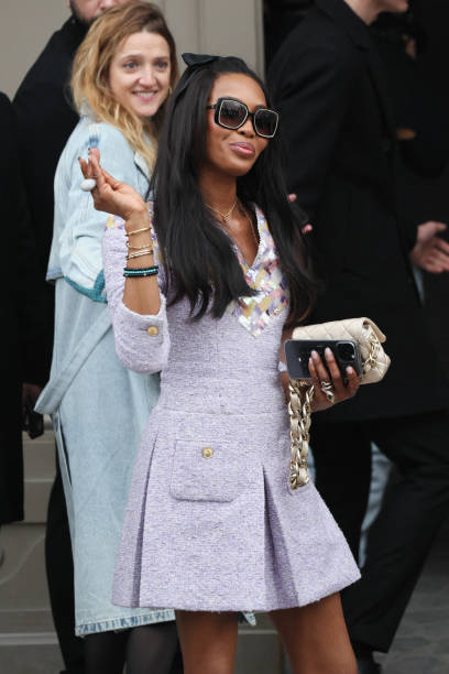 British super model Naomi Campbell waves as she arrives to attend the presentation by Chanel for the Womenswear Ready-to-wear Fall-Winter 2025/2026...