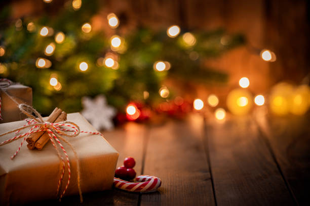 brown christmas gift box on rustic wooden table. - home decoration stock pictures, royalty-free photos & images
