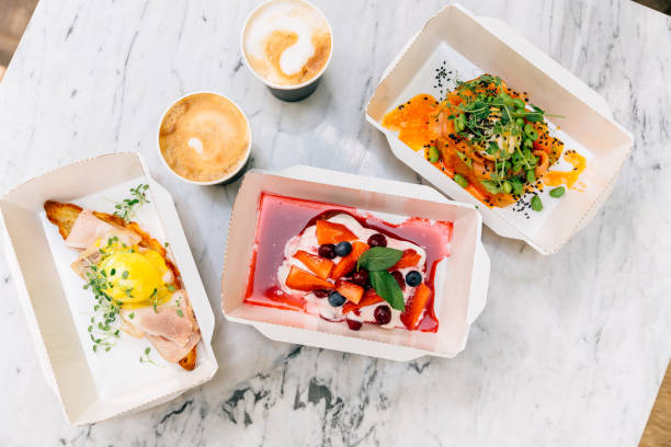 brunch packed for take out in cardboard box containers, high angle view - junk food stock pictures, royalty-free photos & images