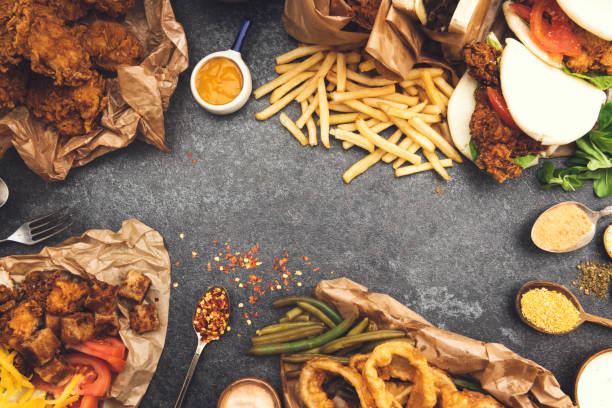 bunch of food ready to eat - junk food stock pictures, royalty-free photos & images