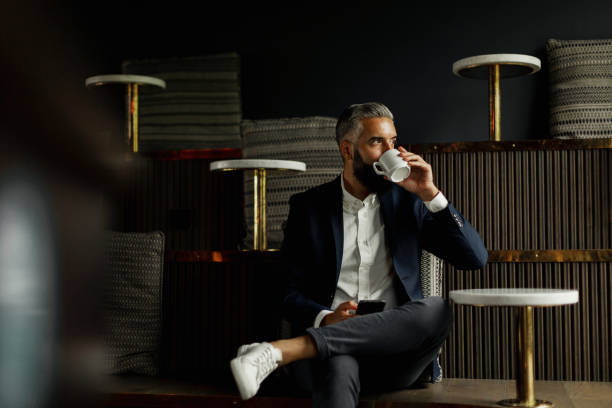 businessman drinking coffee in cafe - coffee stock pictures, royalty-free photos & images