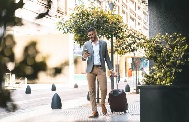 businessman entering in hotel - travel stock pictures, royalty-free photos & images