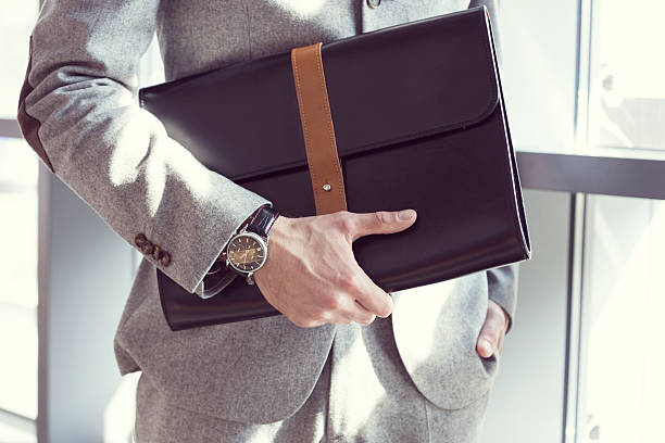 businessman holding briefcase, close up - fashion stock pictures, royalty-free photos & images