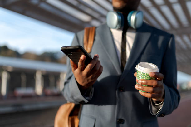 businessman using his phone - junk food stock pictures, royalty-free photos & images
