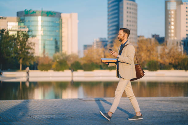 businessman with pizza after work - junk food stock pictures, royalty-free photos & images