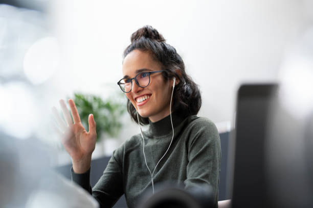 businesswoman waving hand - hairstyle stock pictures, royalty-free photos & images
