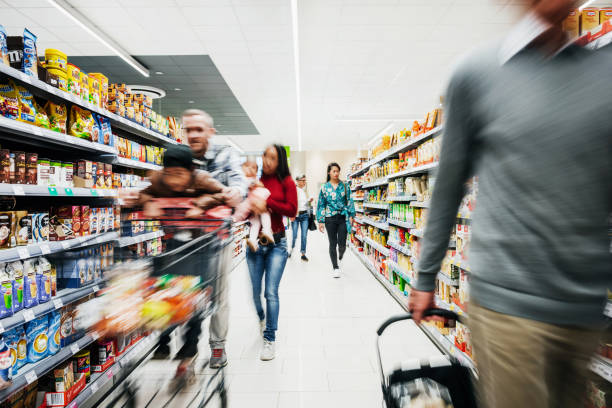 busy supermarket aisle with customers - food stock pictures, royalty-free photos & images