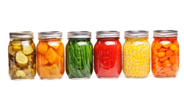 canning food jars of canned vegetables preserved in glass storage - food stock pictures, royalty-free photos & images