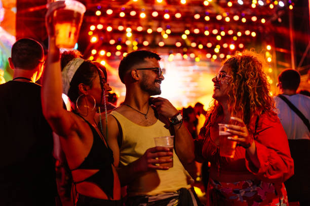 carefree friends at summer festival - concert stock pictures, royalty-free photos & images