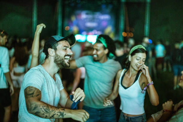 carefree man having fun on music concert. - concert stock pictures, royalty-free photos & images
