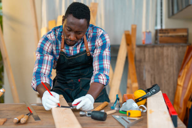 carpenter working on planks at the workshop - home decoration stock pictures, royalty-free photos & images