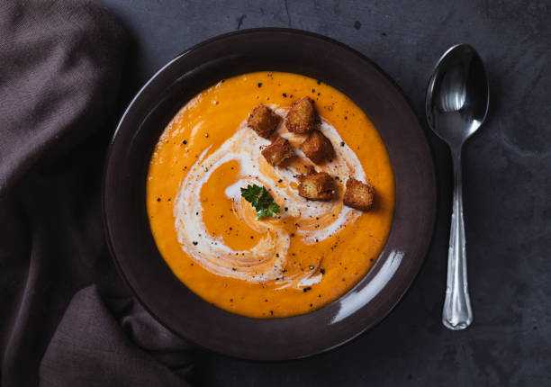 carrot soup with cream and croutons - home decoration stock pictures, royalty-free photos & images