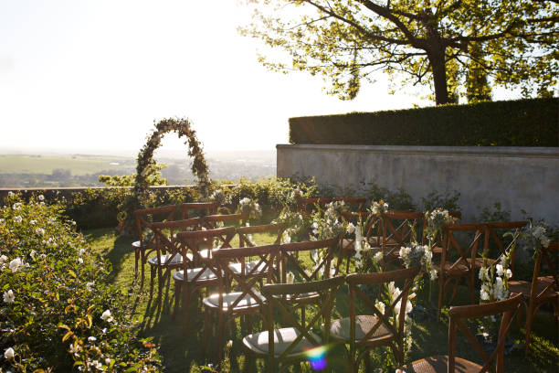 chairs decorated near wedding altar during ceremony - garden decoration stock pictures, royalty-free photos & images