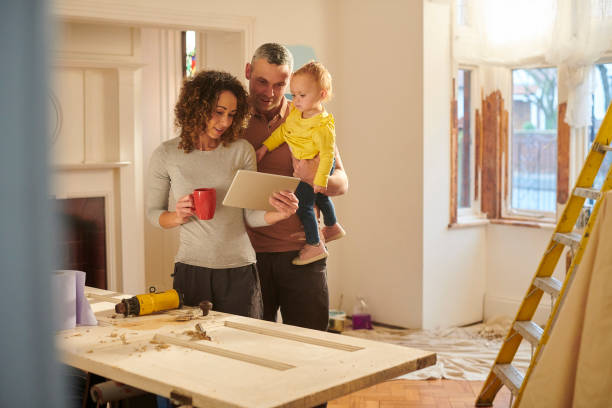 checking their house insurance - home decoration stock pictures, royalty-free photos & images