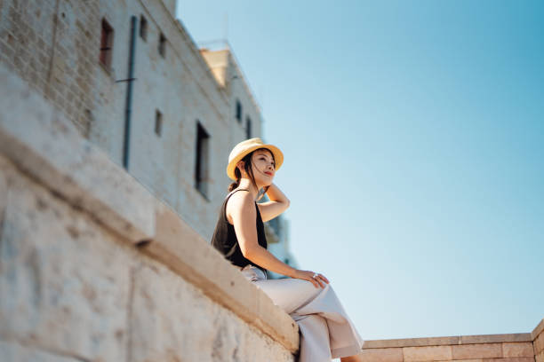 cheerful young asian woman enjoying summer vacations in italy - travel stock pictures, royalty-free photos & images