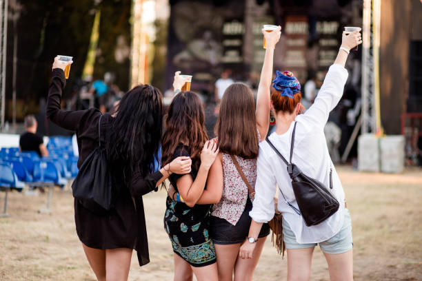 cheering for their favorite music cocnert - concert stock pictures, royalty-free photos & images