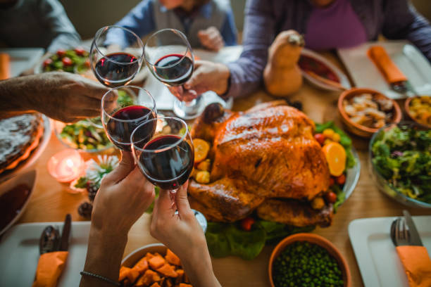 cheers to this great thanksgiving dinner! - food stock pictures, royalty-free photos & images
