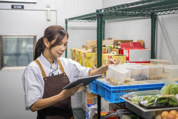 chef checking stock in storage room - food stock pictures, royalty-free photos & images