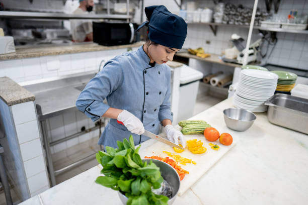 chef chopping vegetables in a commercial kitchen - food stock pictures, royalty-free photos & images
